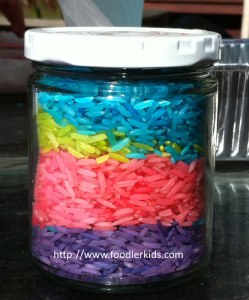 Jar filled with layers of dyed rice